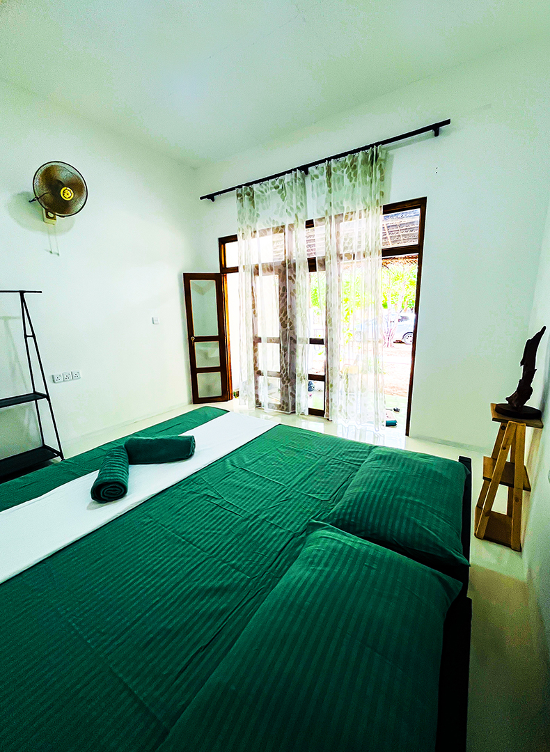 Non-AC room bed and bamboo side table